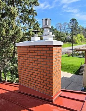 red brick chimney with caps