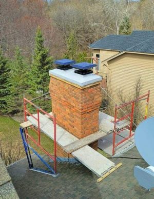 chimney of roof in suburbs being worked on.