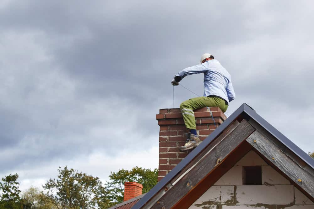 What Are The Key Warning Signs That Indicate A Chimney Needs Professional Inspection Or Repair?